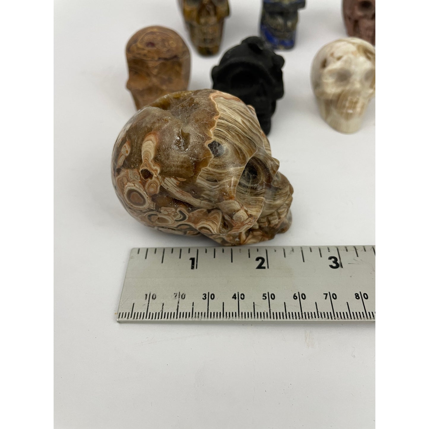 Lot of 13 Carved Skulls Unique Crystal & Resin Mixed