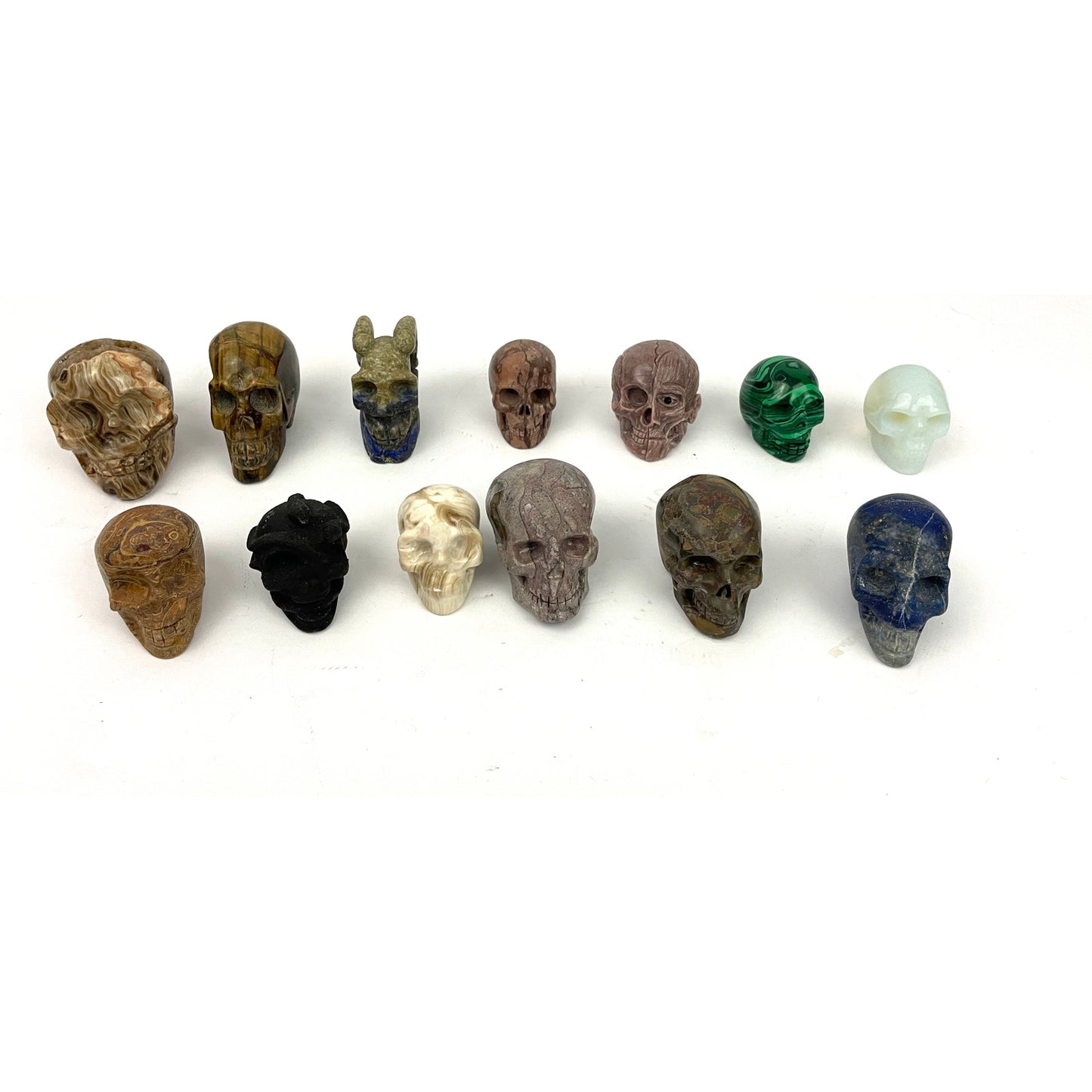 Lot of 13 Carved Skulls Unique Crystal & Resin Mixed