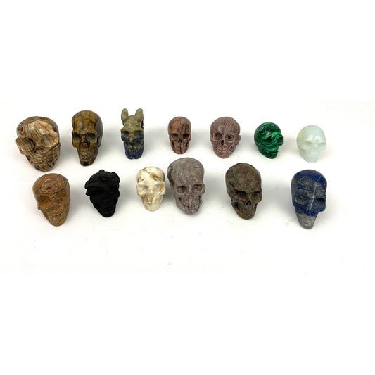 Lot of 13 Carved Skulls Unique Crystal & Resin Mixed