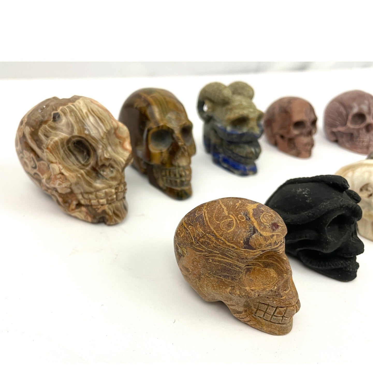 Lot of 13 Carved Skulls Unique Crystal & Resin Mixed